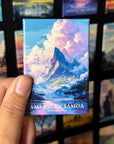 A hand holding a magnet with an illustration of a mountain landscape, specifically American Samoa, with the text "AMERICAN SAMOA NATIONAL PARK" printed on it.