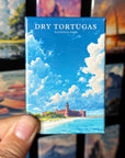 A hand holding a small magnet with a picture of a lighthouse and a beach, with the text "Dry Tortugas National Park" written on it.