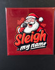 A red tile with a cartoon image of Santa Claus holding a microphone and singing, accompanied by the text "Sleigh my name".
