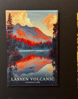 A framed magnet depicting a scenic landscape with a lake and mountains, with the text "LASSEN VOLCANIC NATIONAL PARK" printed on it.