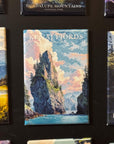 a collection of landscape magnets, including one with a mountain and a body of water, as well as another with a forest and a mountain.