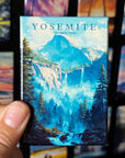 A hand holding a magnet with a scenic image of Yosemite National Park, featuring a waterfall and forest.