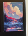 The image is a magnet depicting a scenic landscape with a waterfall and clouds, with the text "HOT SPRINGS NATIONAL PARK" below it.