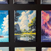 a collection of magnets depicting various landscapes, including Everglades, Great Sand Dunes, and Carlsbad Caves.