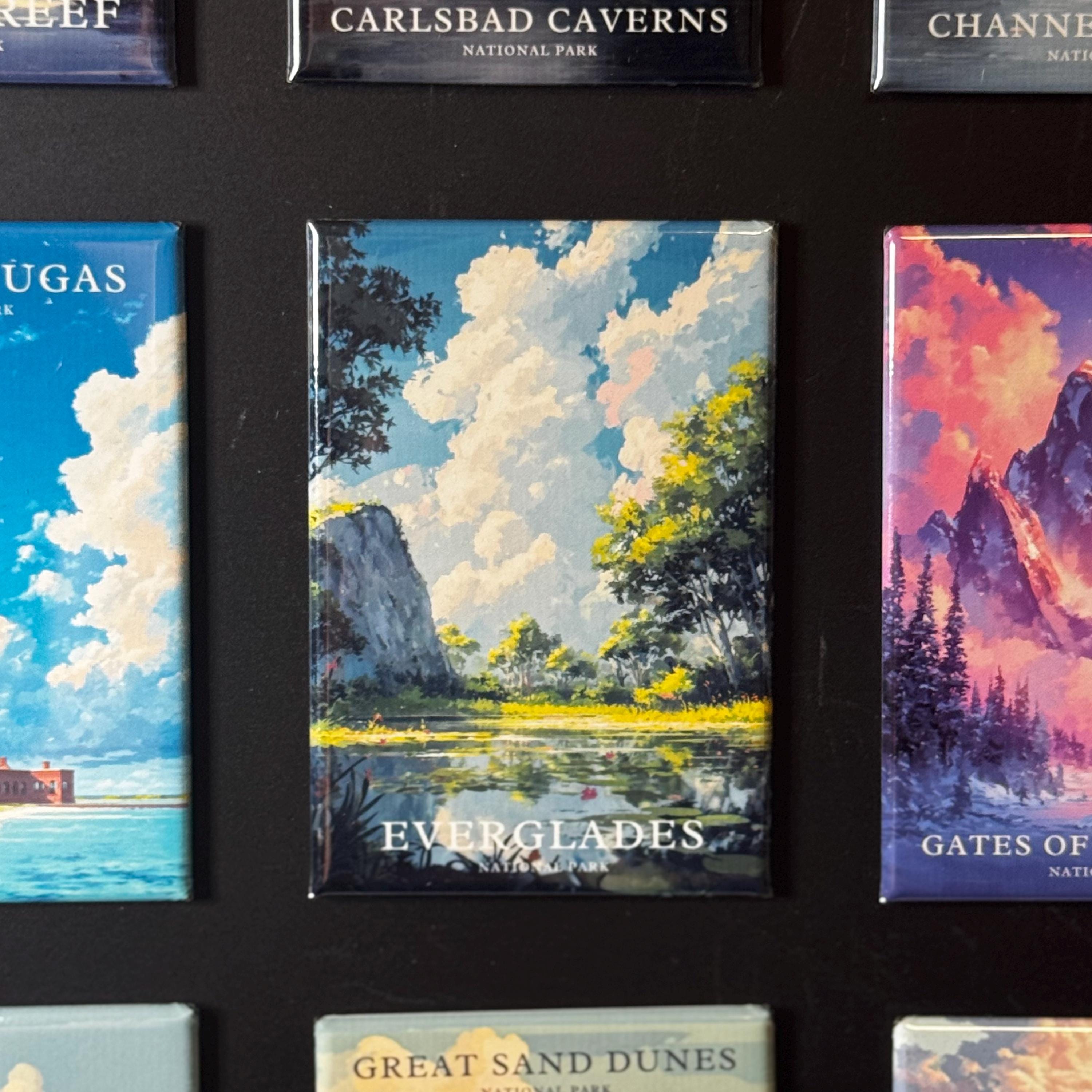 a collection of magnets depicting various landscapes, including Everglades, Great Sand Dunes, and Carlsbad Caves.