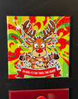 A colorful, festive Christmas-themed tile with a cartoon reindeer holding a banner that says "OH deer, it&
