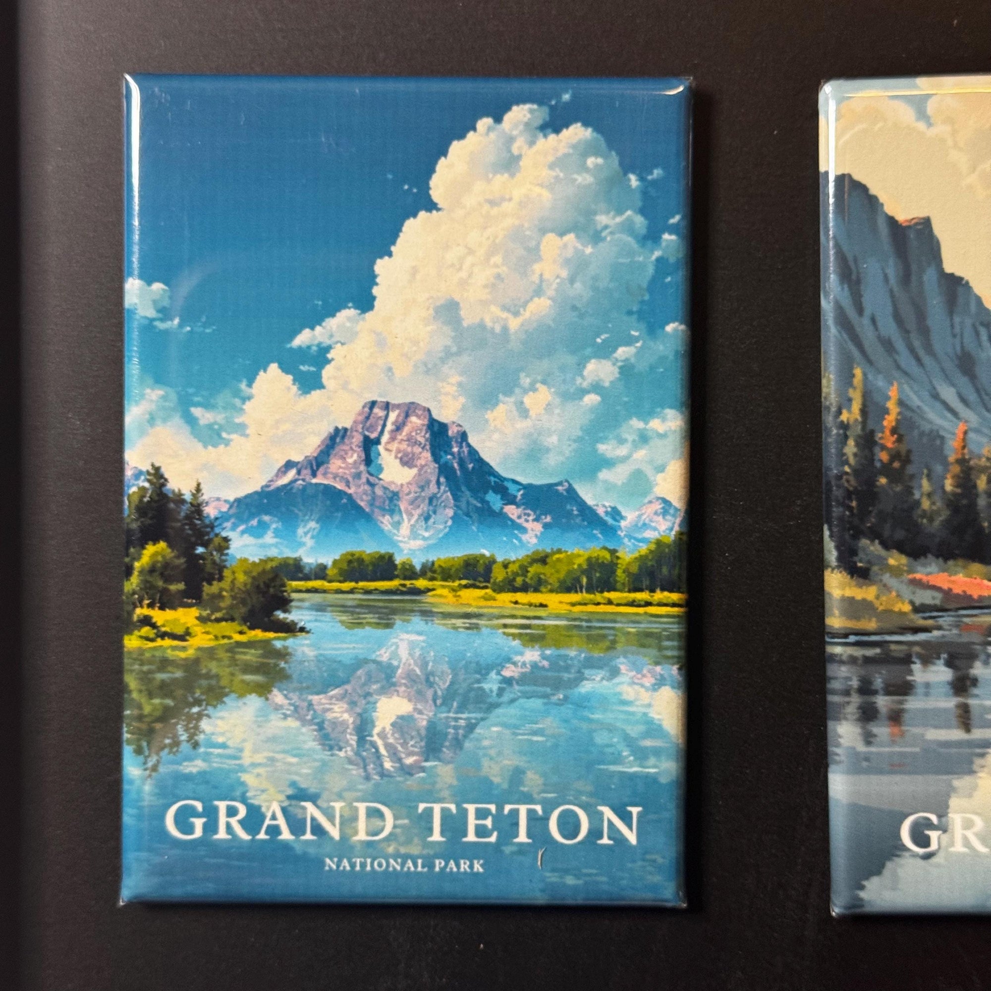 a large, majestic mountain range with a lake in the foreground, creating a serene and picturesque landscape.