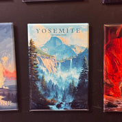 a framed print of a scenic mountain landscape with a waterfall, surrounded by pine trees.