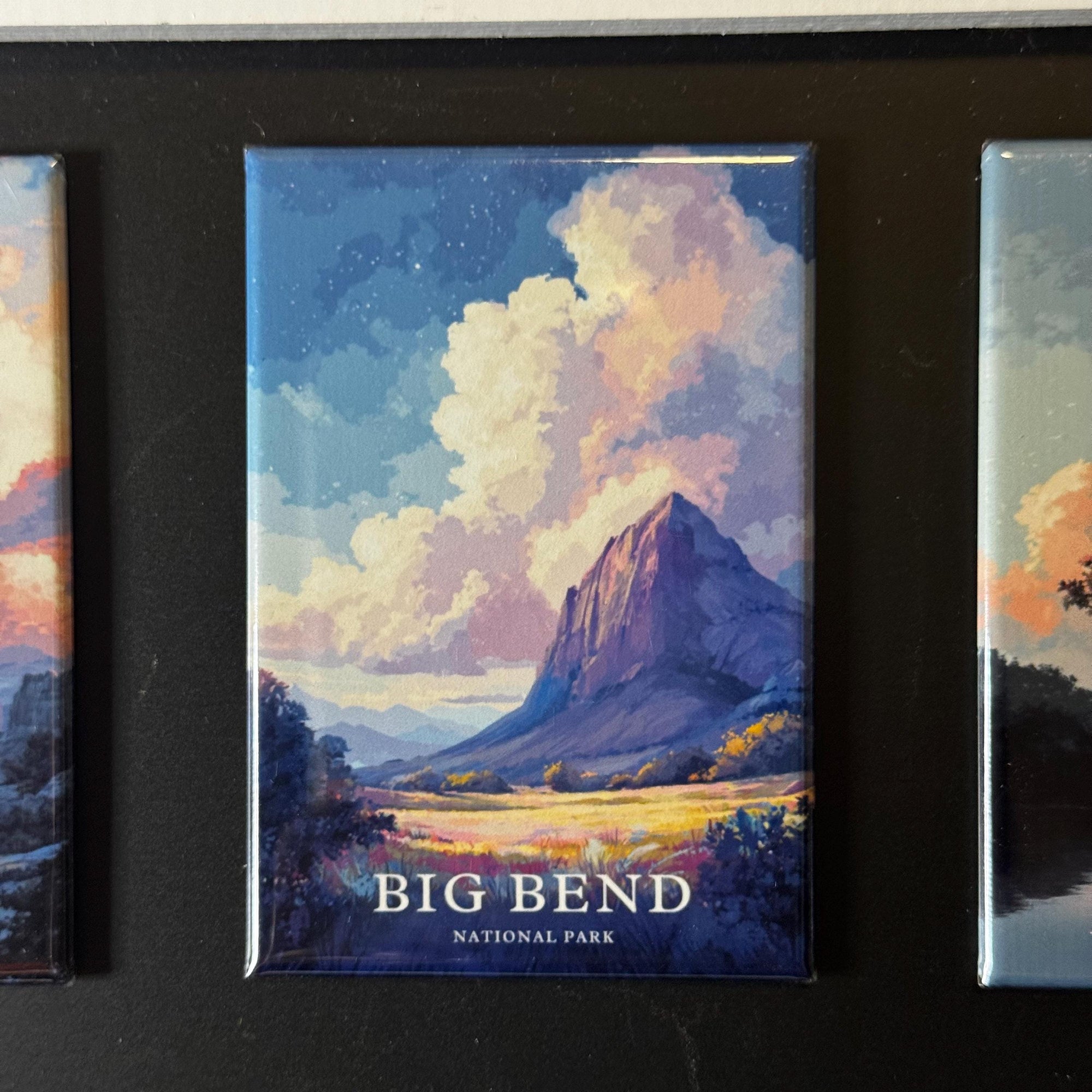 a large, colorful painting of a mountain landscape with clouds, which is a representation of Big Bend National Park.