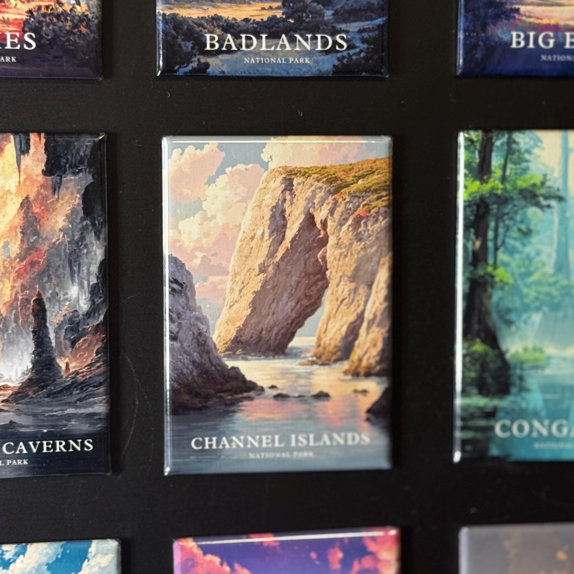 a collection of magnets or postcards featuring various landscapes, including mountains, cliffs, and bodies of water. The magnets are arranged in a grid-like pattern, with each one showcasing a different natural scene. The magnets are not described in detail, and the focus is on the visual content rather than providing specific information about each image.